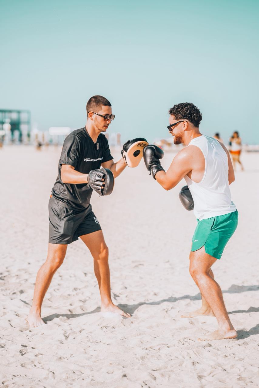 Coaching session on Dubai beach with client